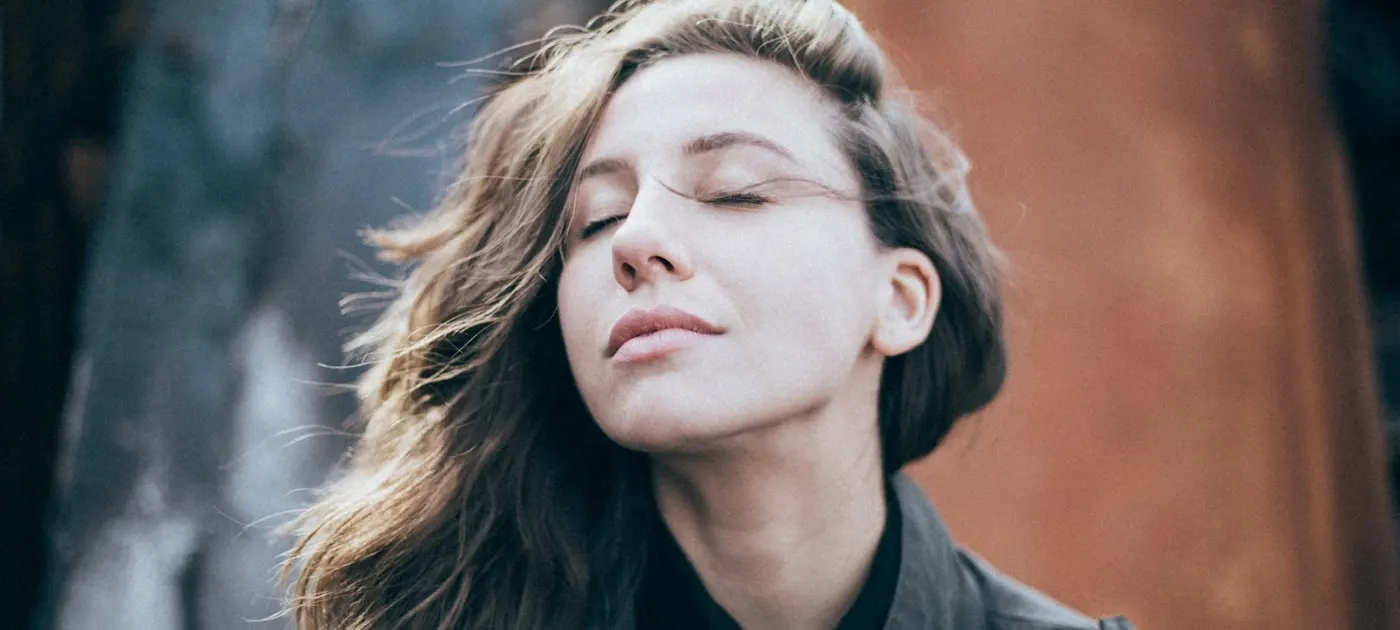 closeup photo of woman wearing black top