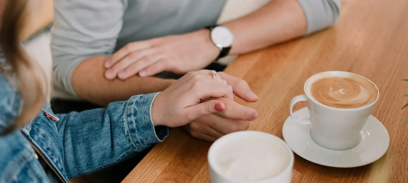 man and woman holding hands