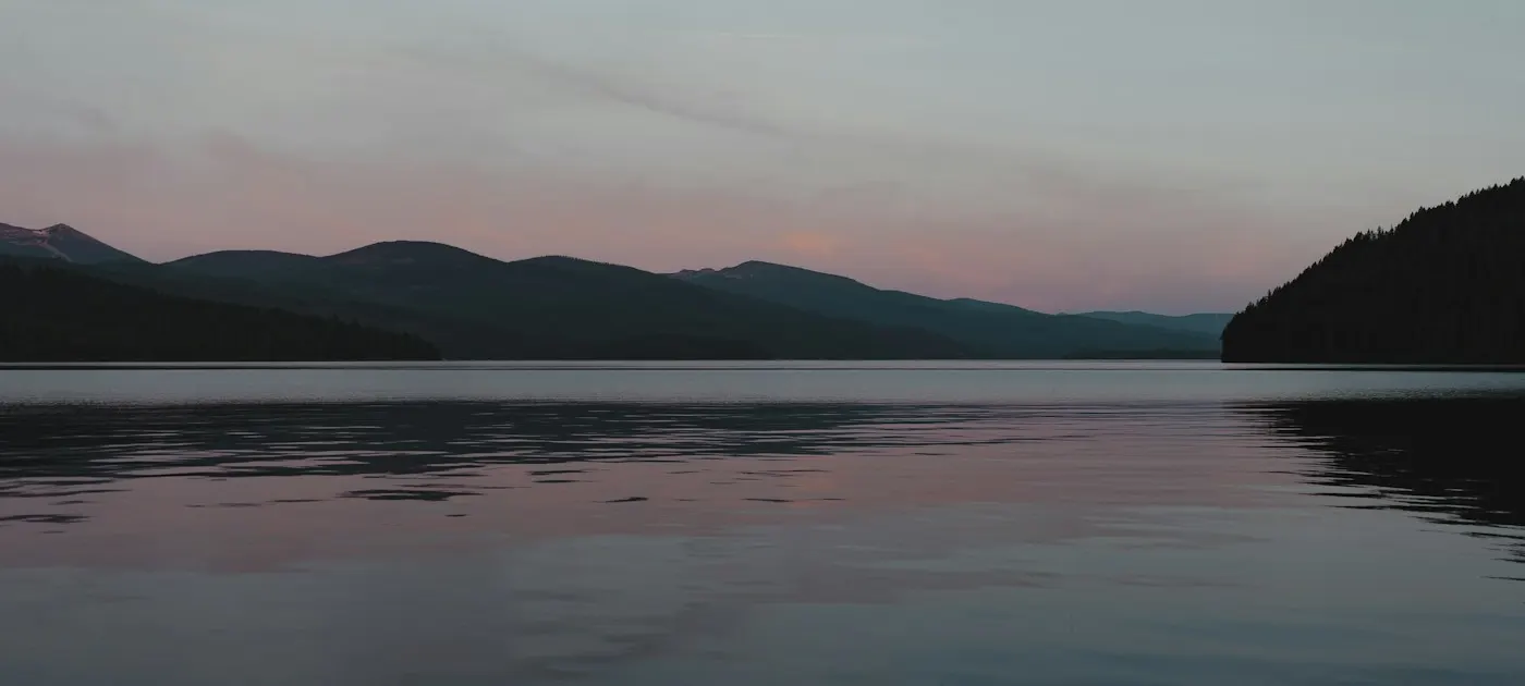 A calm lake at sunset